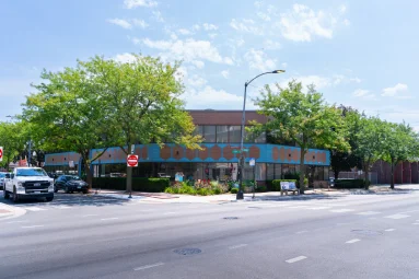 An El Valor building on a city street corner.