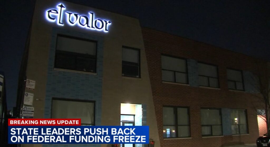 News broadcast showing the El Valor building at night.