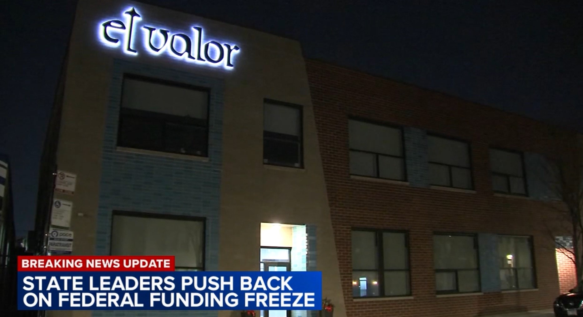 News broadcast showing the El Valor building at night.