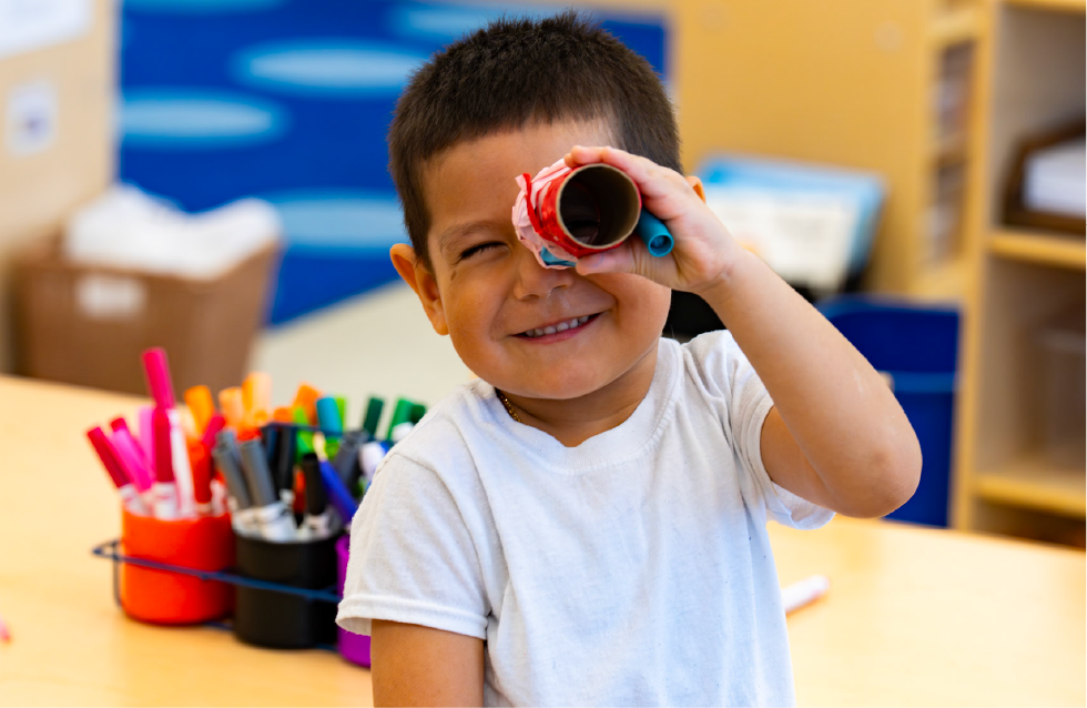 Young boy playing with crafts