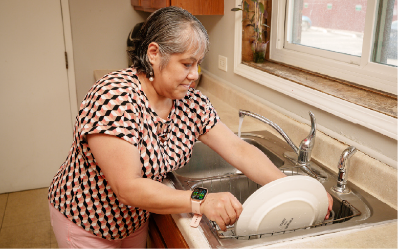 Adult washing dishes