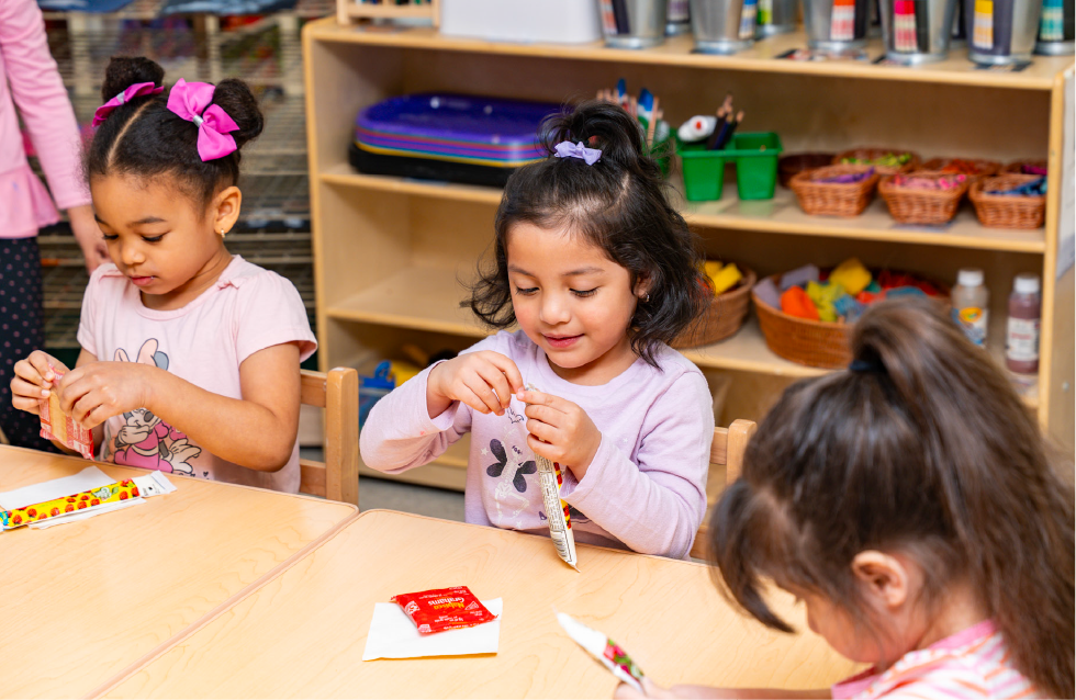 3 Young girls making crafts together