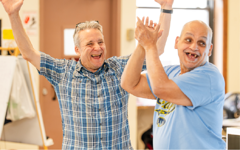 Two adults cheering