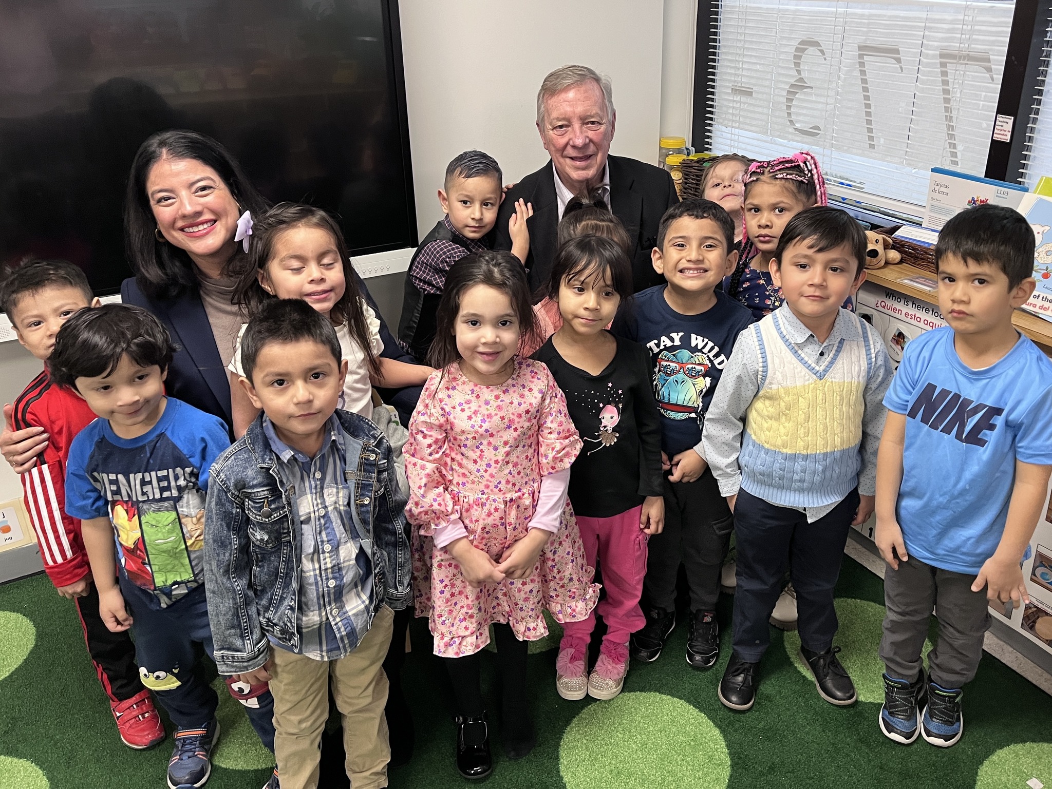 A large group of Head Start children pose together for a photo.