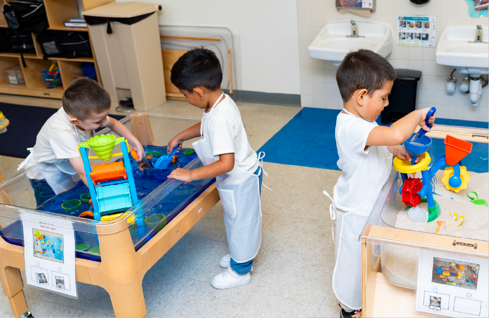 Children engaged in freeplay with sandboxes