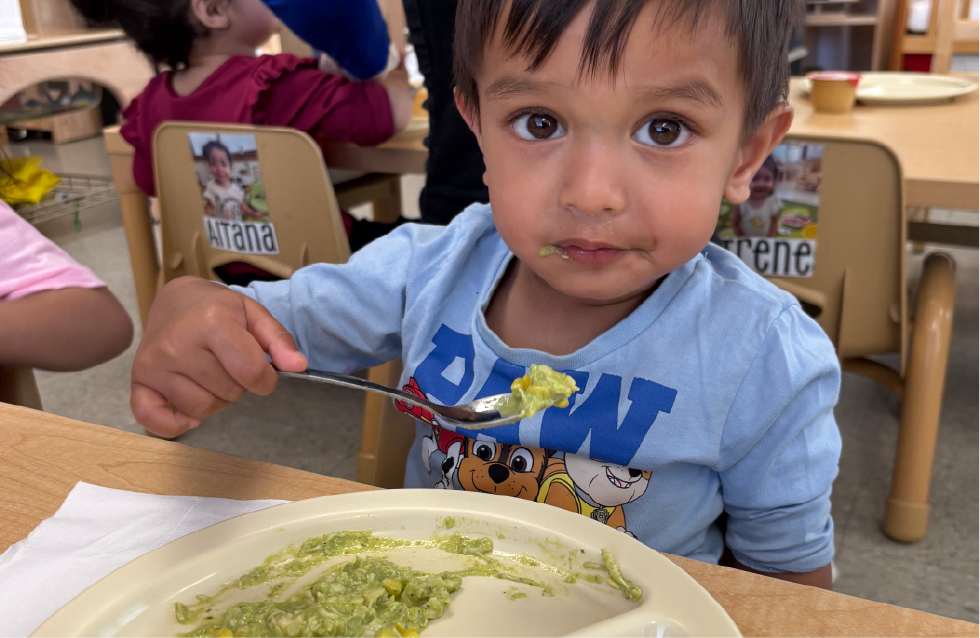 Young boy eating lunch